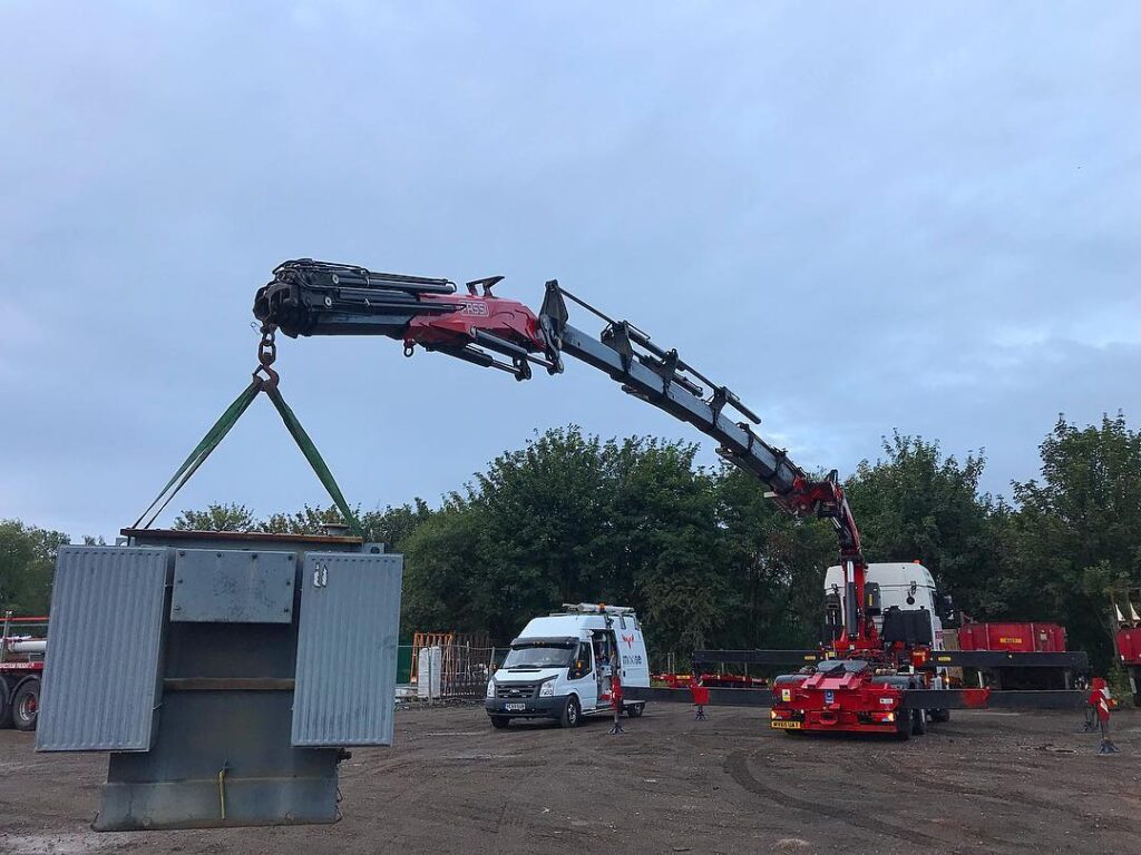 Lorry loader crane lifting a weight for a test